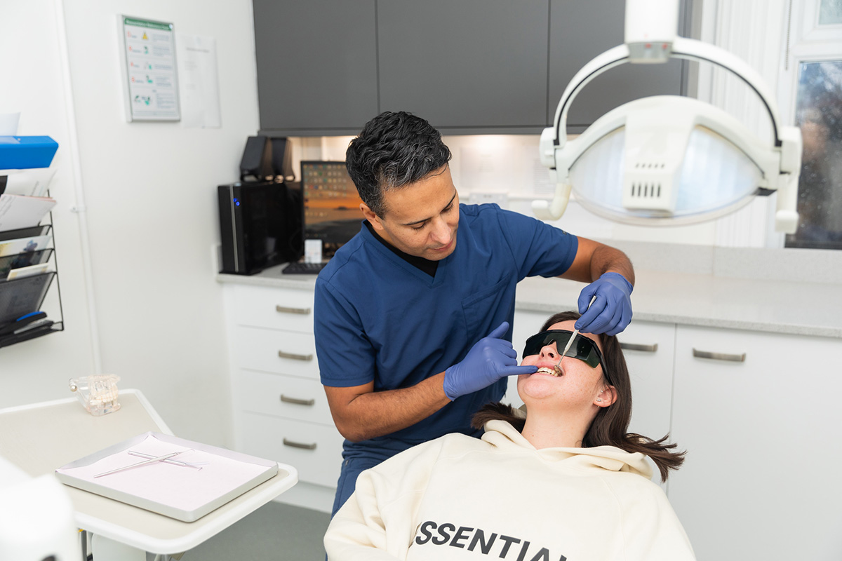 Happy patient looking in a mirror